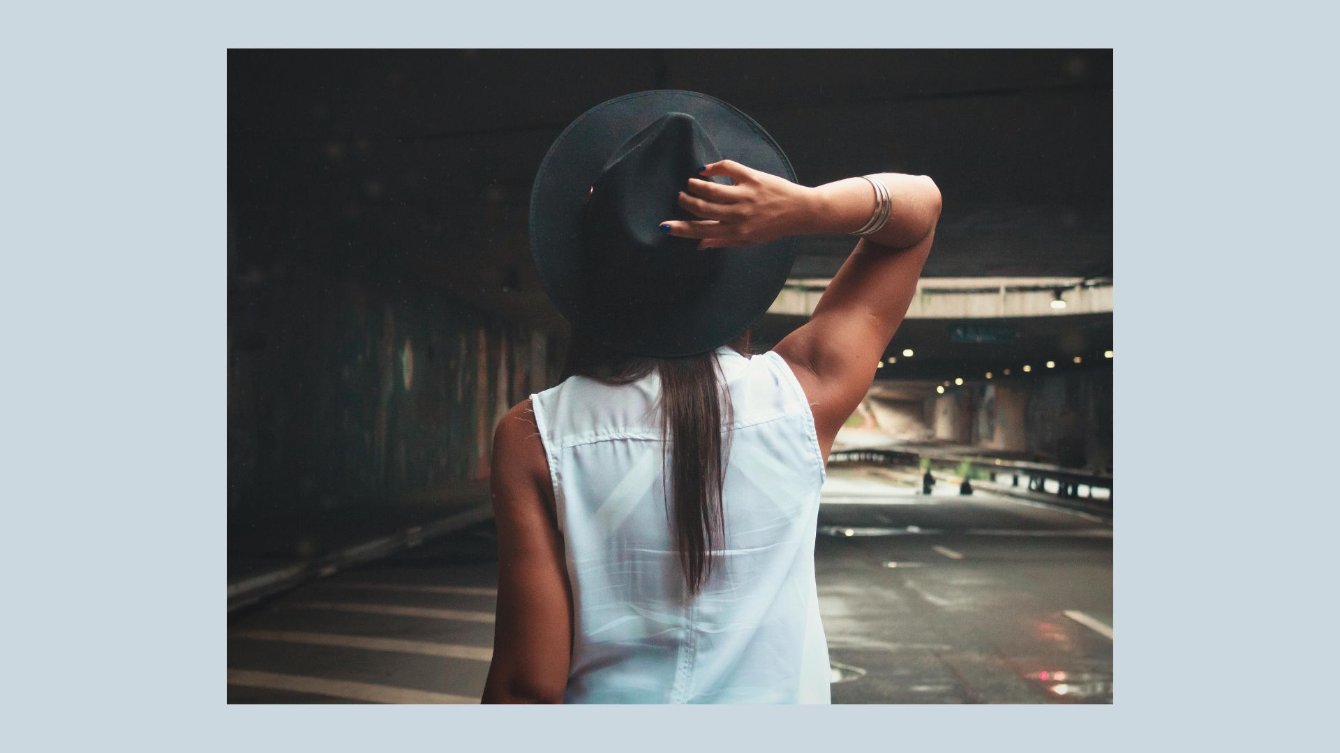 Woman with dark her and hat